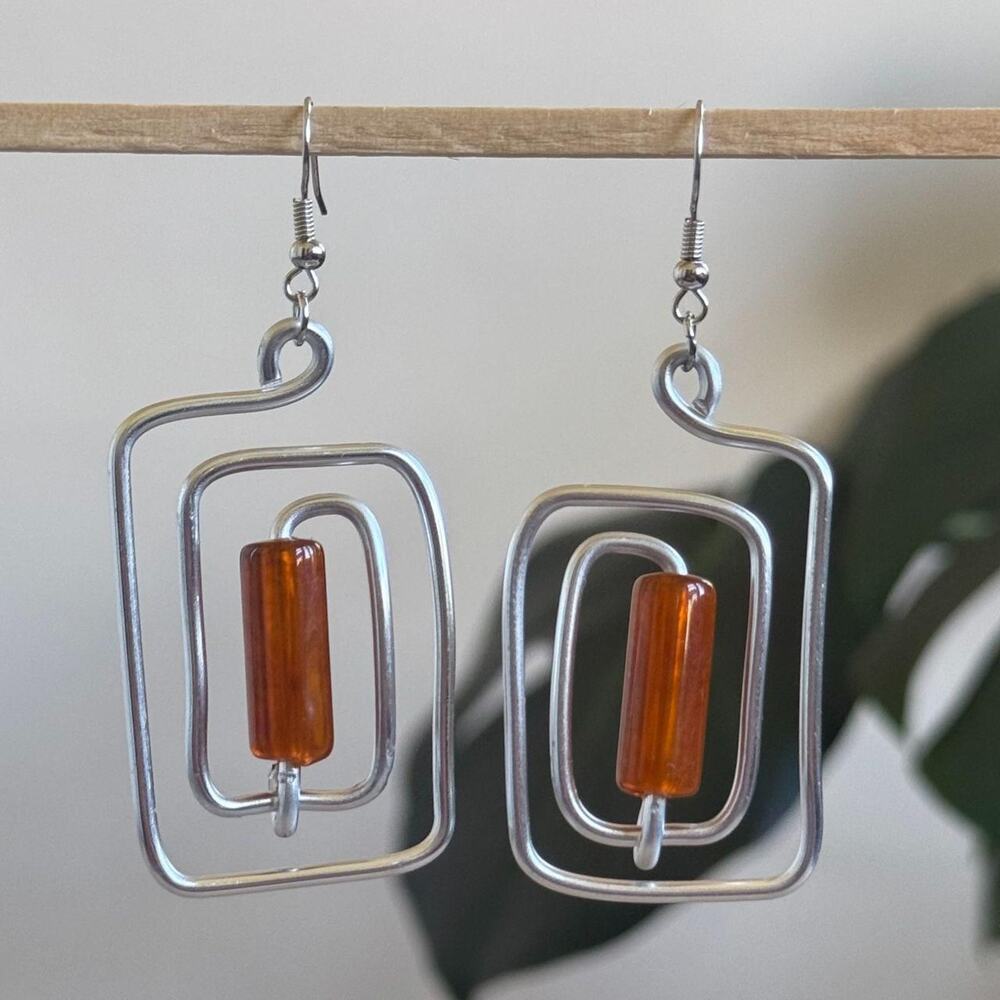 handmade silver wire spiral earrings with brown colored tube beads